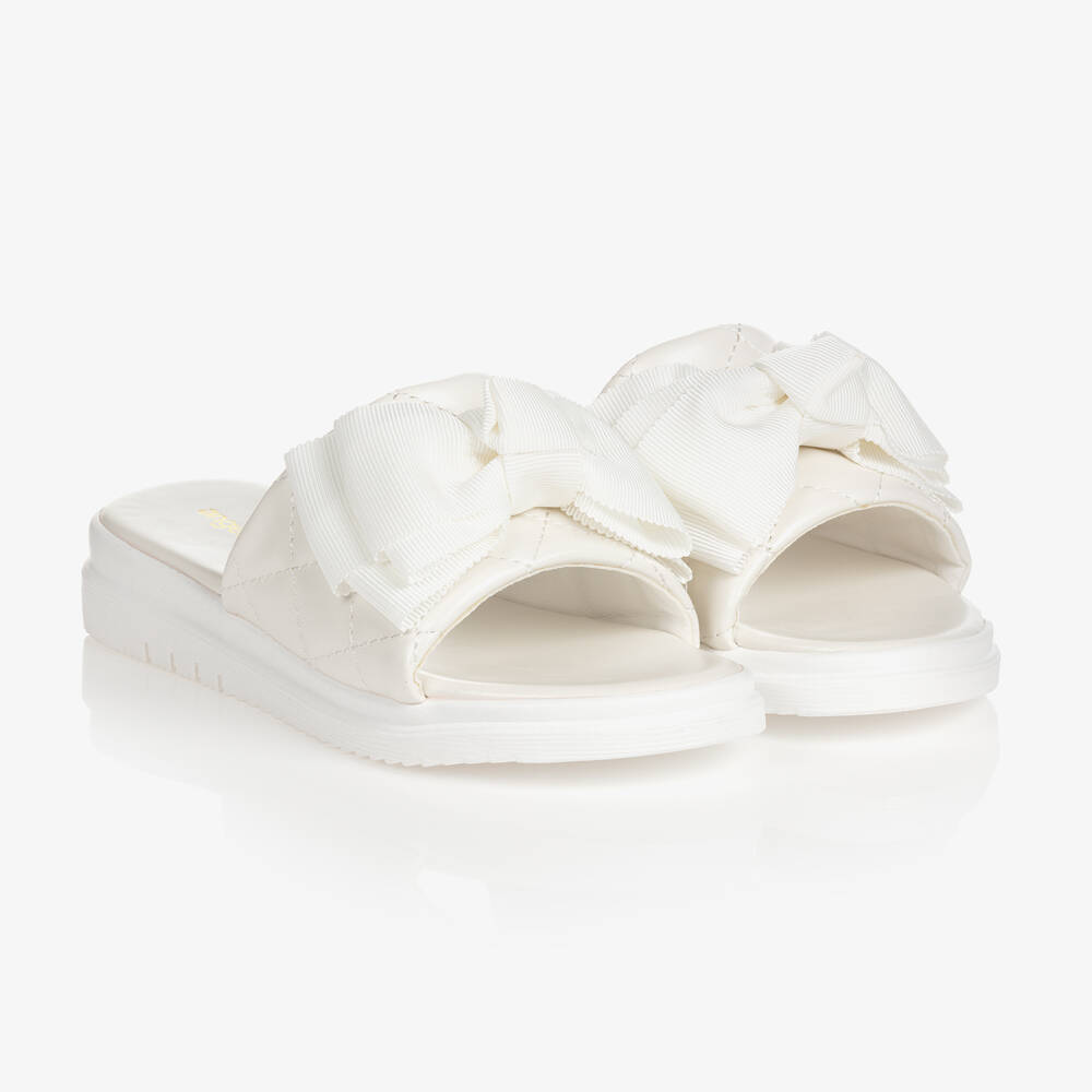 Angel's Face - Girls White Bow Quilted Sliders | Childrensalon