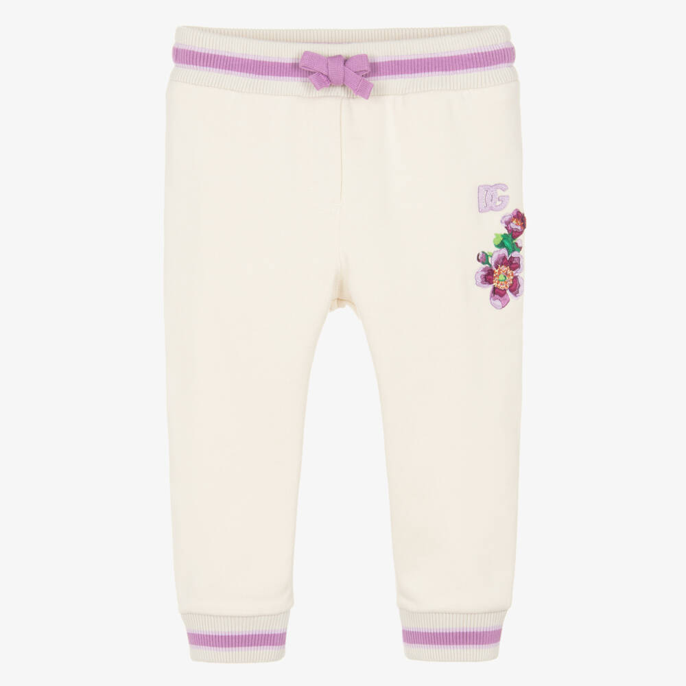 Dolce & Gabbana-Baby Girls Ivory Cotton Joggers with Purple Floral Detailing | Childrensalon Outlet