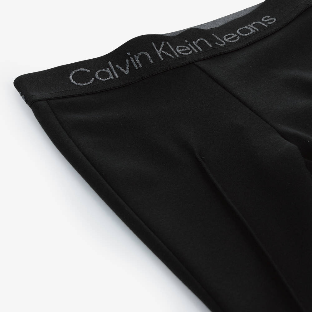 Calvin Klein-Girls Black Flare Jersey Trousers | Childrensalon Outlet