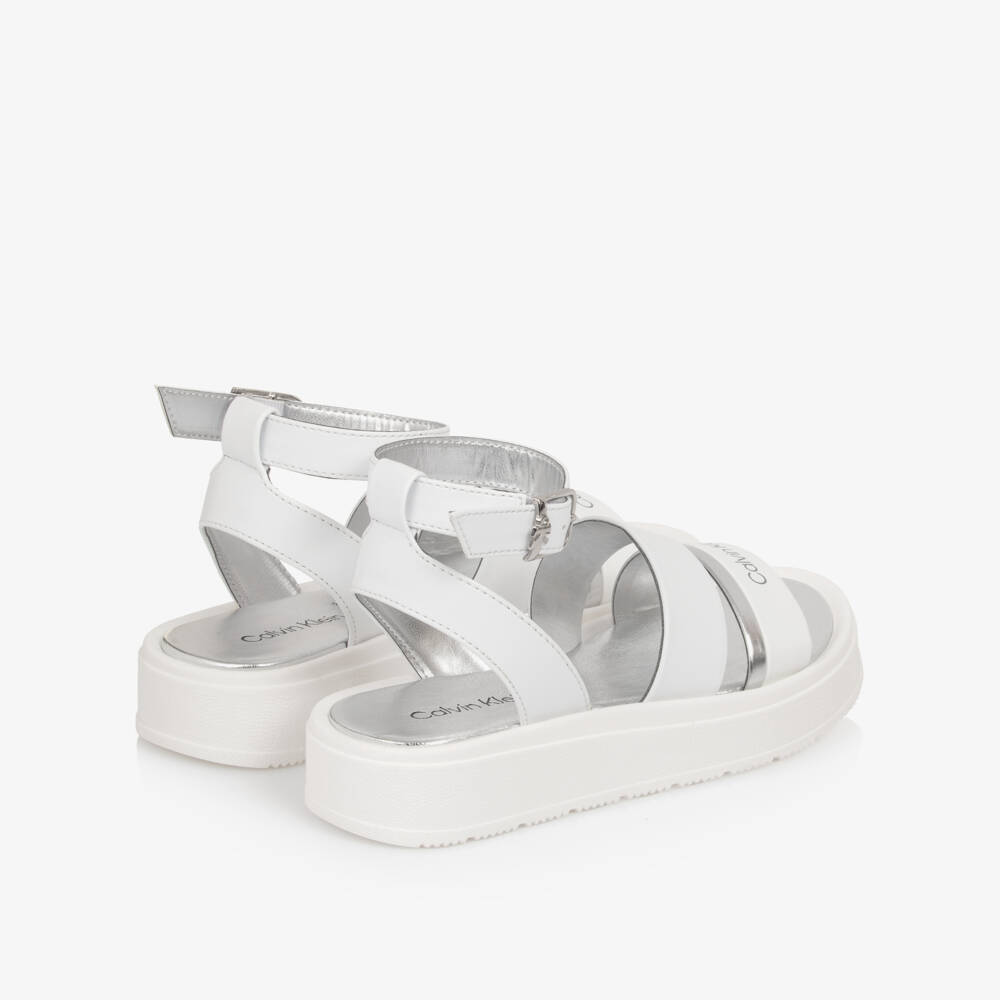 Calvin Klein-Girls White Faux Leather Sandals with Silver Trims | Childrensalon Outlet