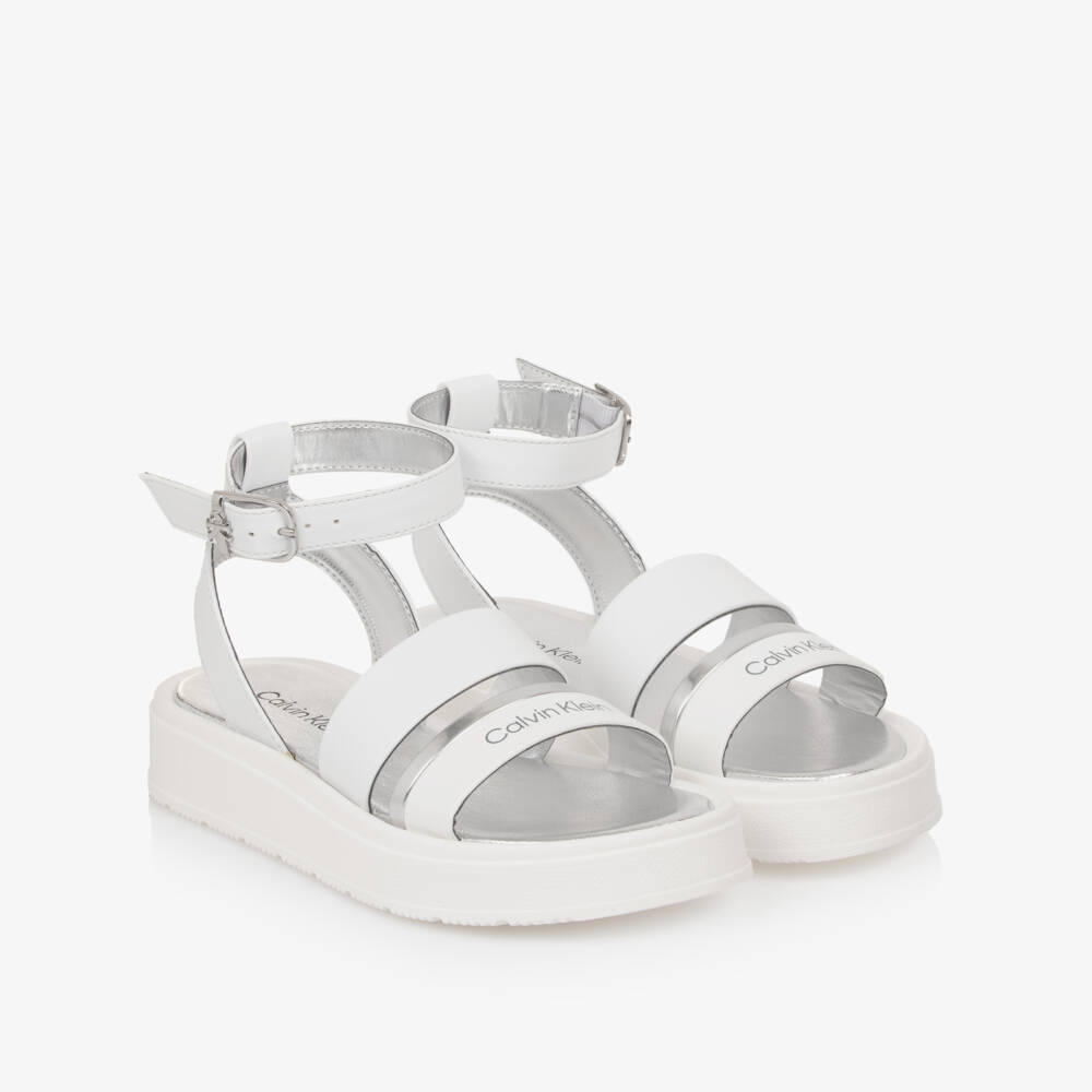 Calvin Klein-Girls White Faux Leather Sandals with Silver Trims | Childrensalon Outlet