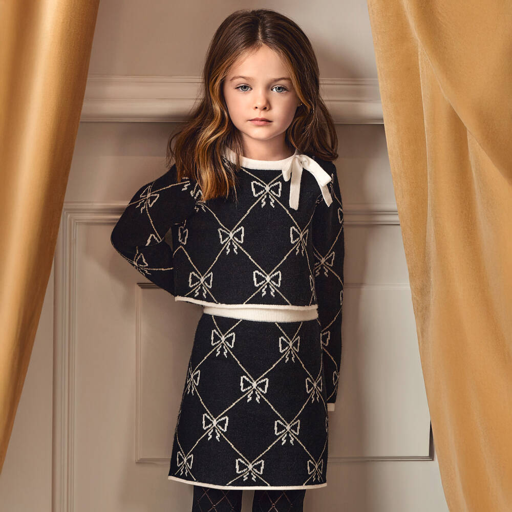 Abel & Lula-Girls Black Knitted Skirt Set with Bow Pattern | Childrensalon Outlet