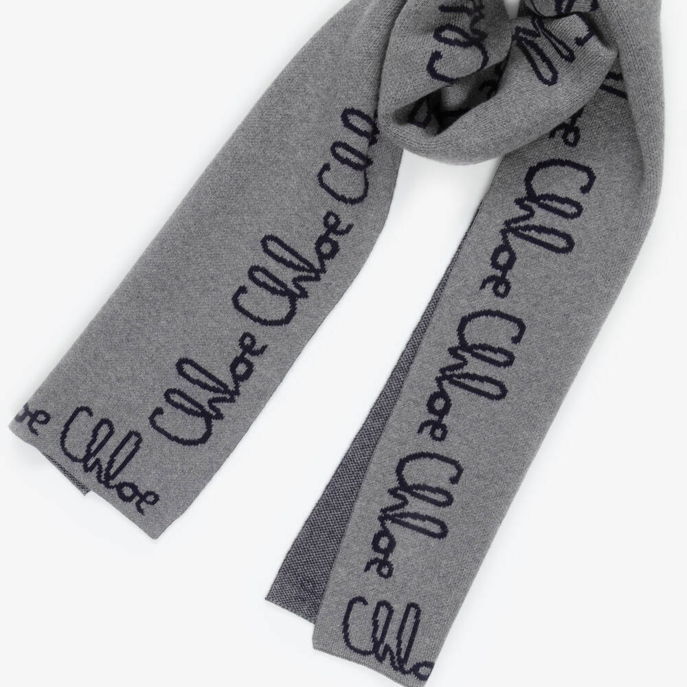 Chloé-Girls Grey Knitted Scarf with Navy Blue Chloé Logo | Childrensalon Outlet