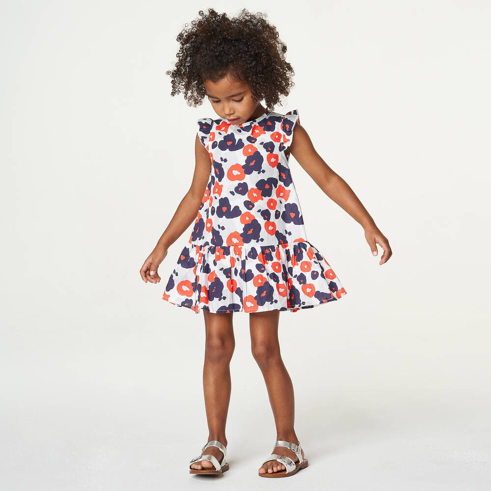 Light blue dress store with red flowers