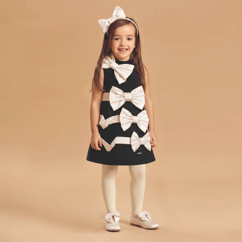 Jessie and James London-Girls Black Dress with Ivory Satin Bows | Childrensalon Outlet