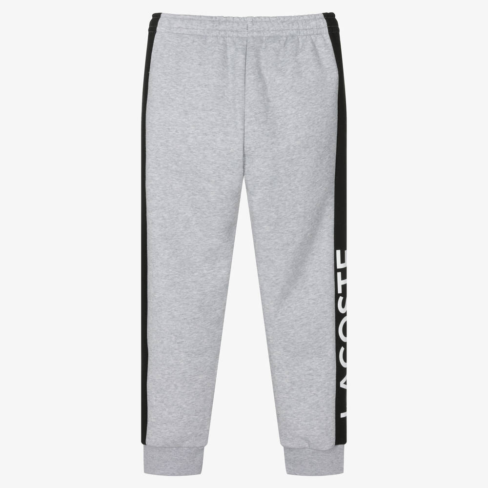Grey joggers with black stripe top