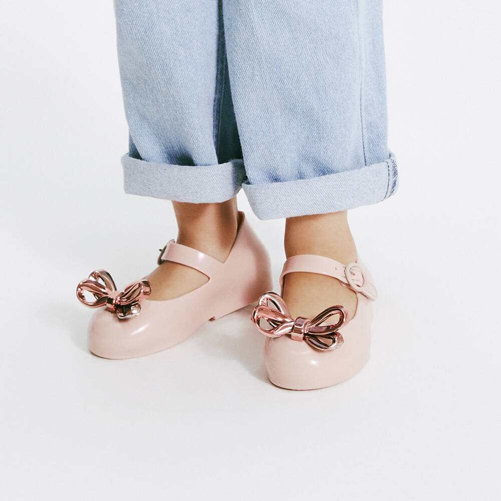 Mini Melissa-Girls Pink Jelly Pumps with Rose Gold Bow | Childrensalon Outlet