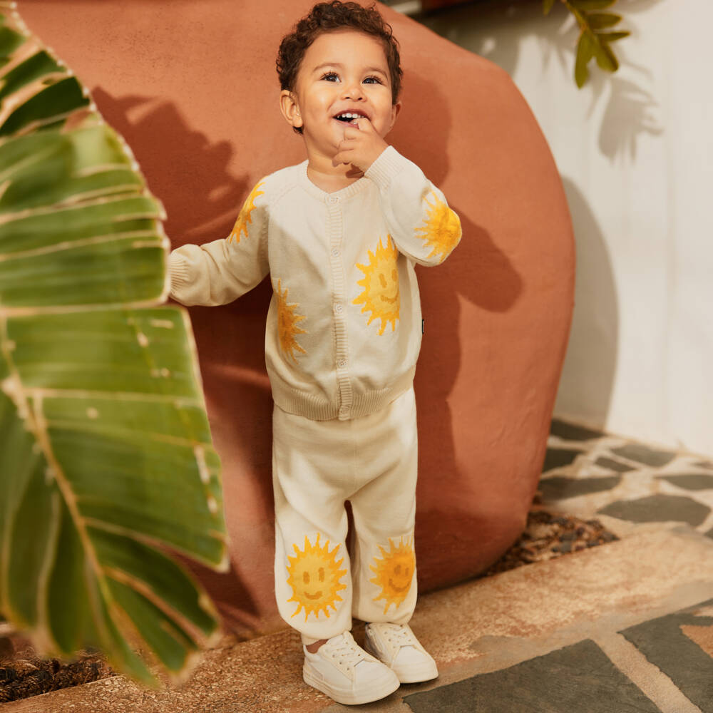 Molo-Ivory Organic Cotton Knitted Trousers with Smiling Sun Faces | Childrensalon Outlet
