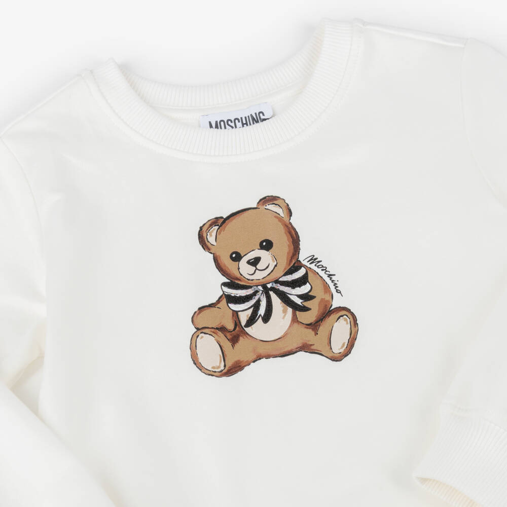 Moschino-فستان عاجي للبنات مع فيونكة ودب تيدي | Childrensalon Outlet