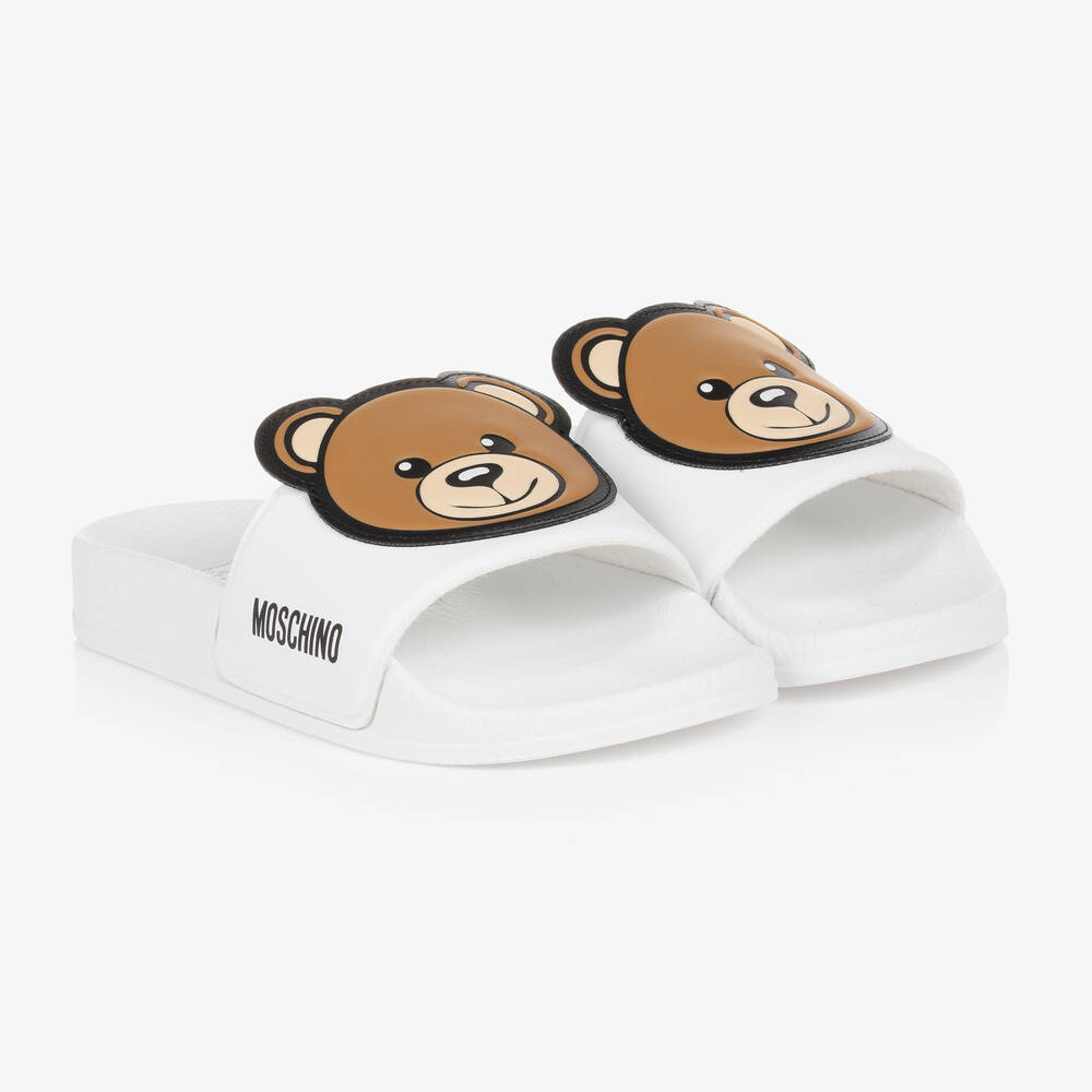 Moschino Kid-Teen - Girls White Teddy Bear Logo Sliders | Childrensalon