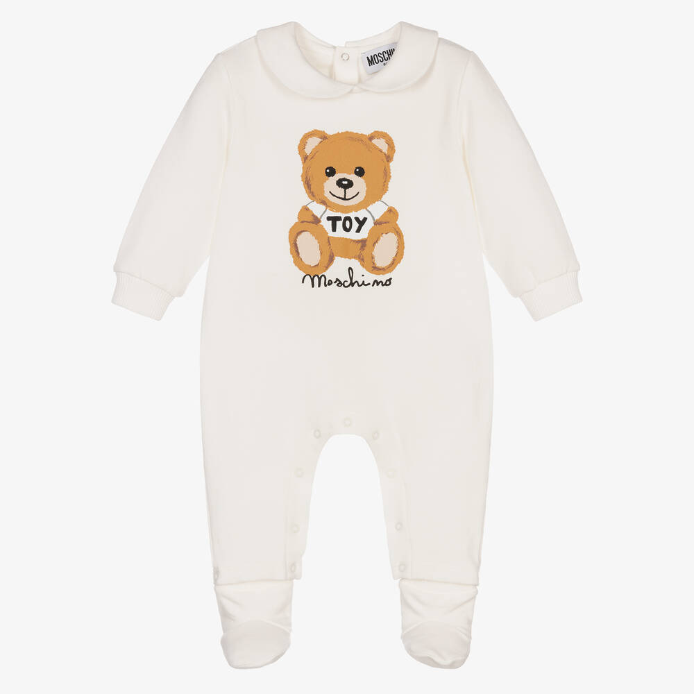 Moschino Baby - Ivory Cotton Logo Babygrow | Childrensalon