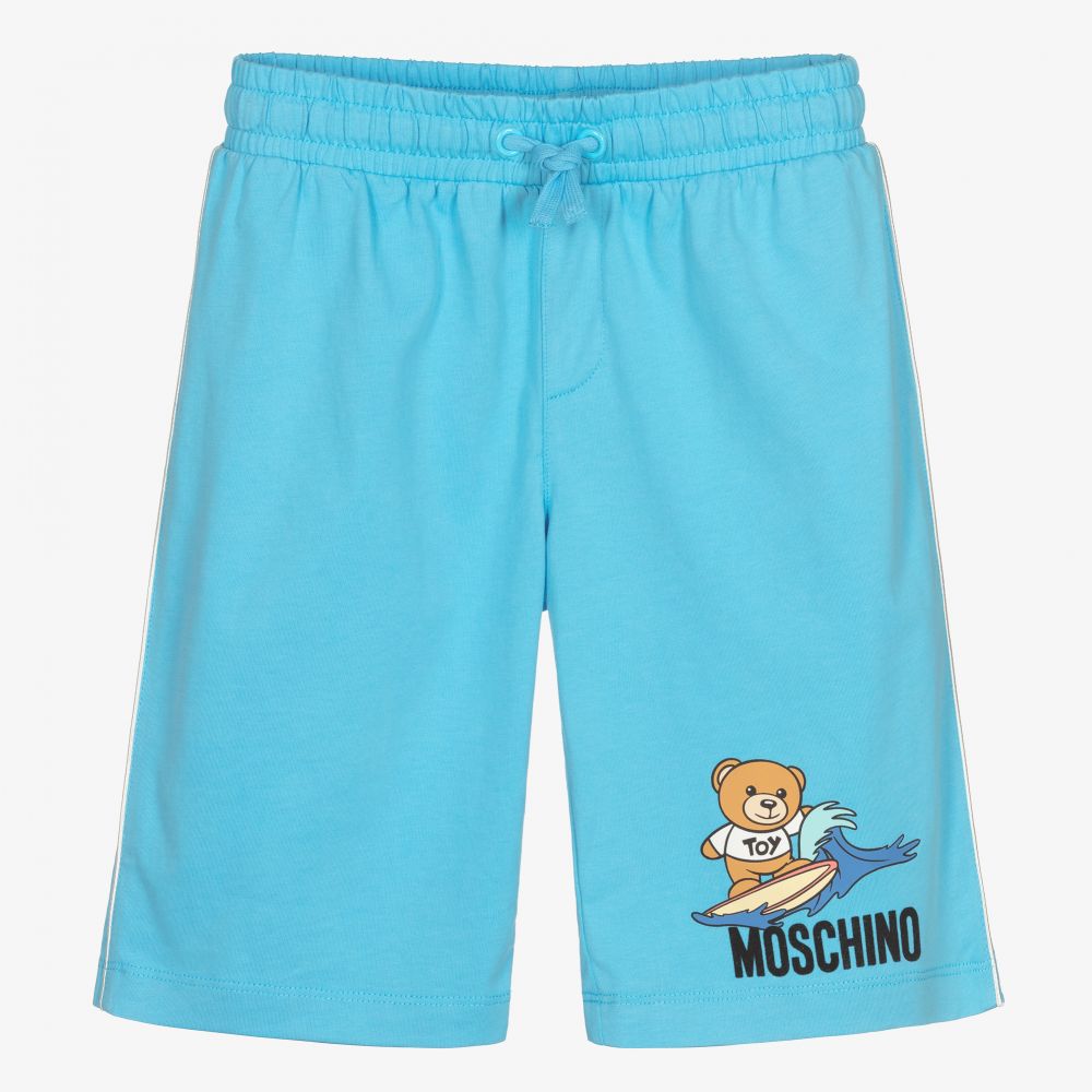 Moschino Kid-Teen - Голубые шорты с медвежонком-серфингистом для подростков | Childrensalon