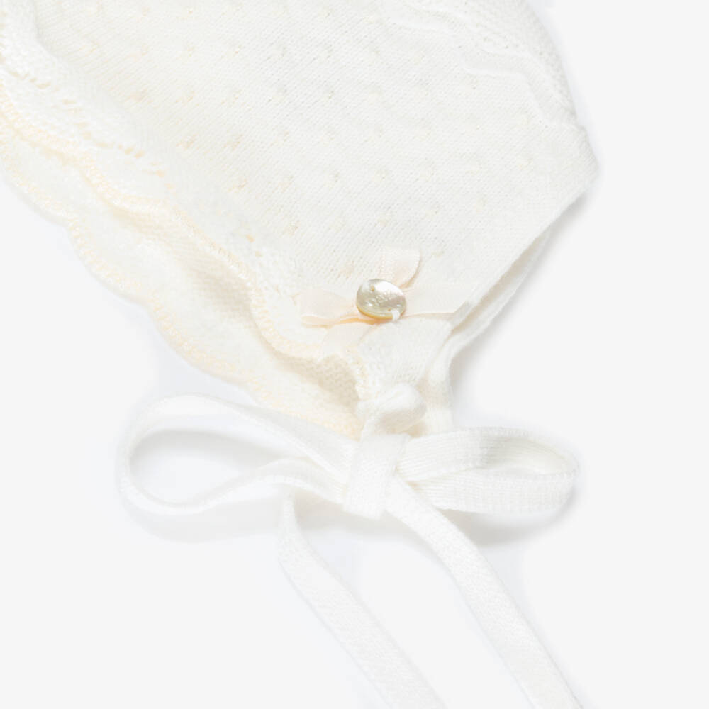 PAZ Rodríguez-Ivory Cotton Knit Baby Bonnet with Knot Stitch Detail | Childrensalon Outlet