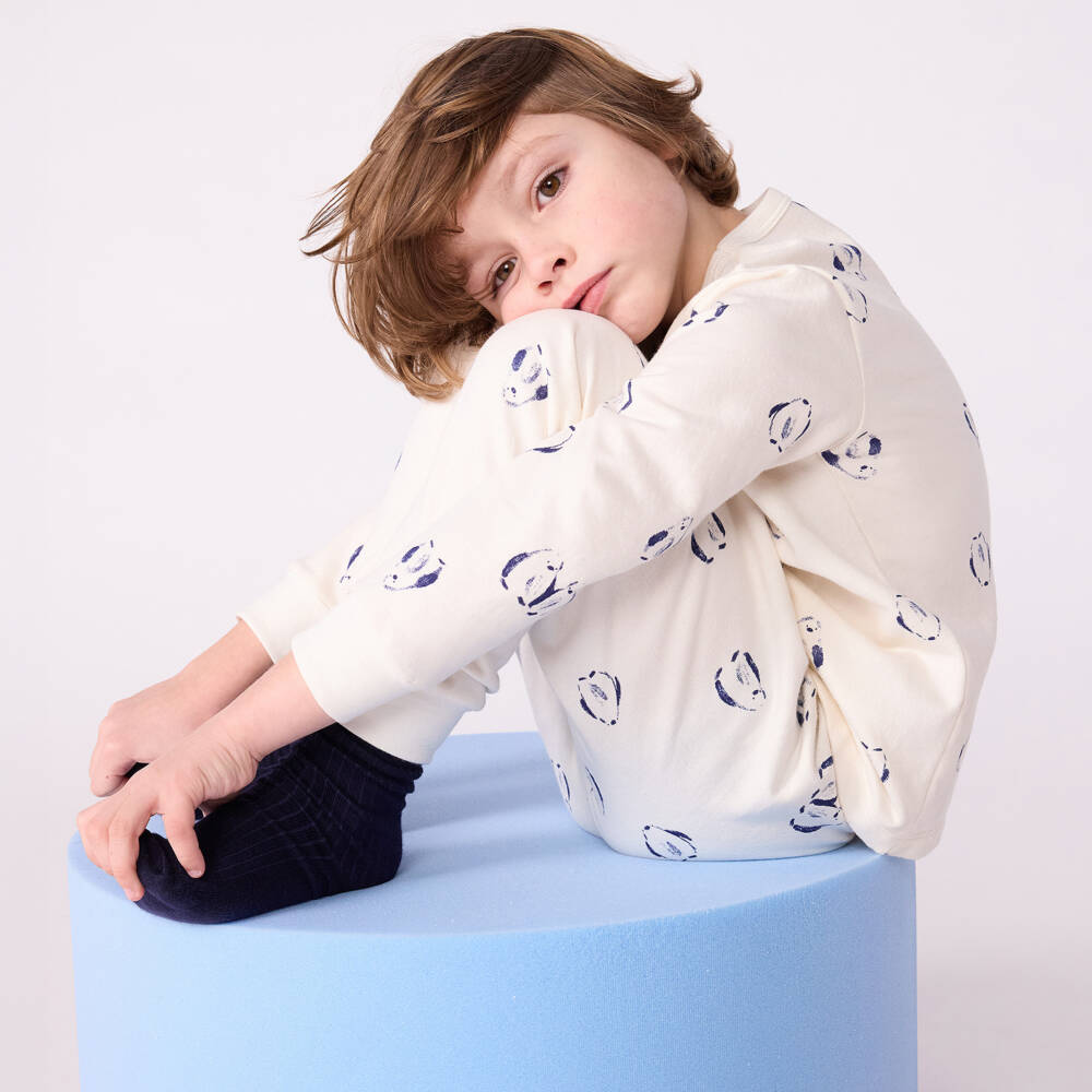 Petit Bateau-Ivory Cotton Pyjamas with Navy Blue Penguin Print | Childrensalon Outlet