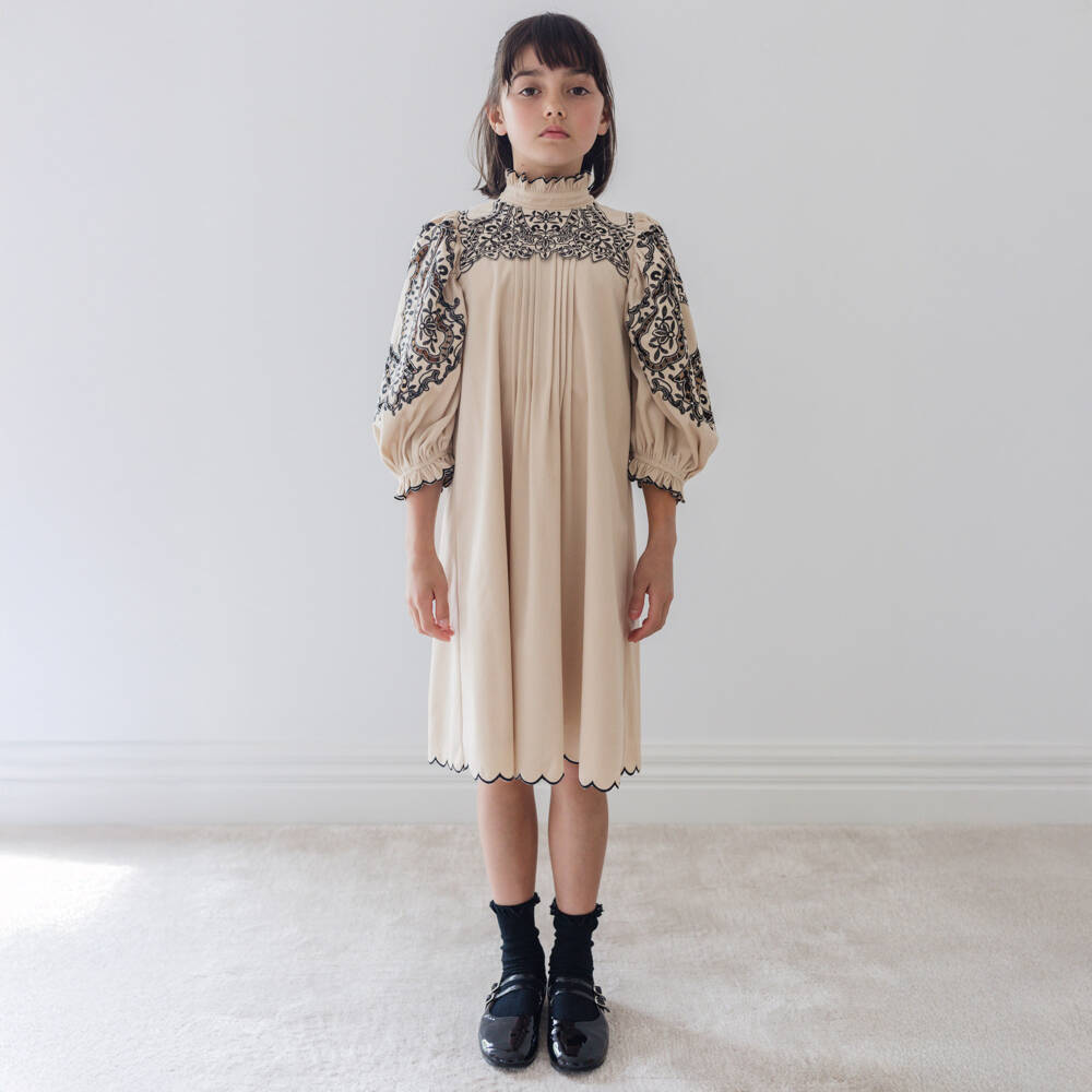 Petite Amalie-Girls Beige Dress with Black Embroidery | Childrensalon Outlet