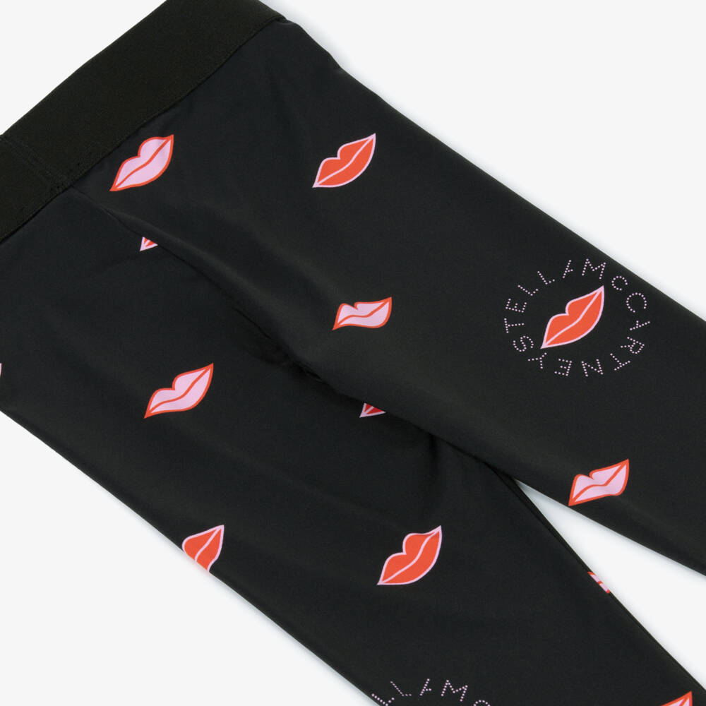 Stella McCartney Kids-Girls Black Leggings with Circular Logo & Pink Lip Print | Childrensalon Outlet