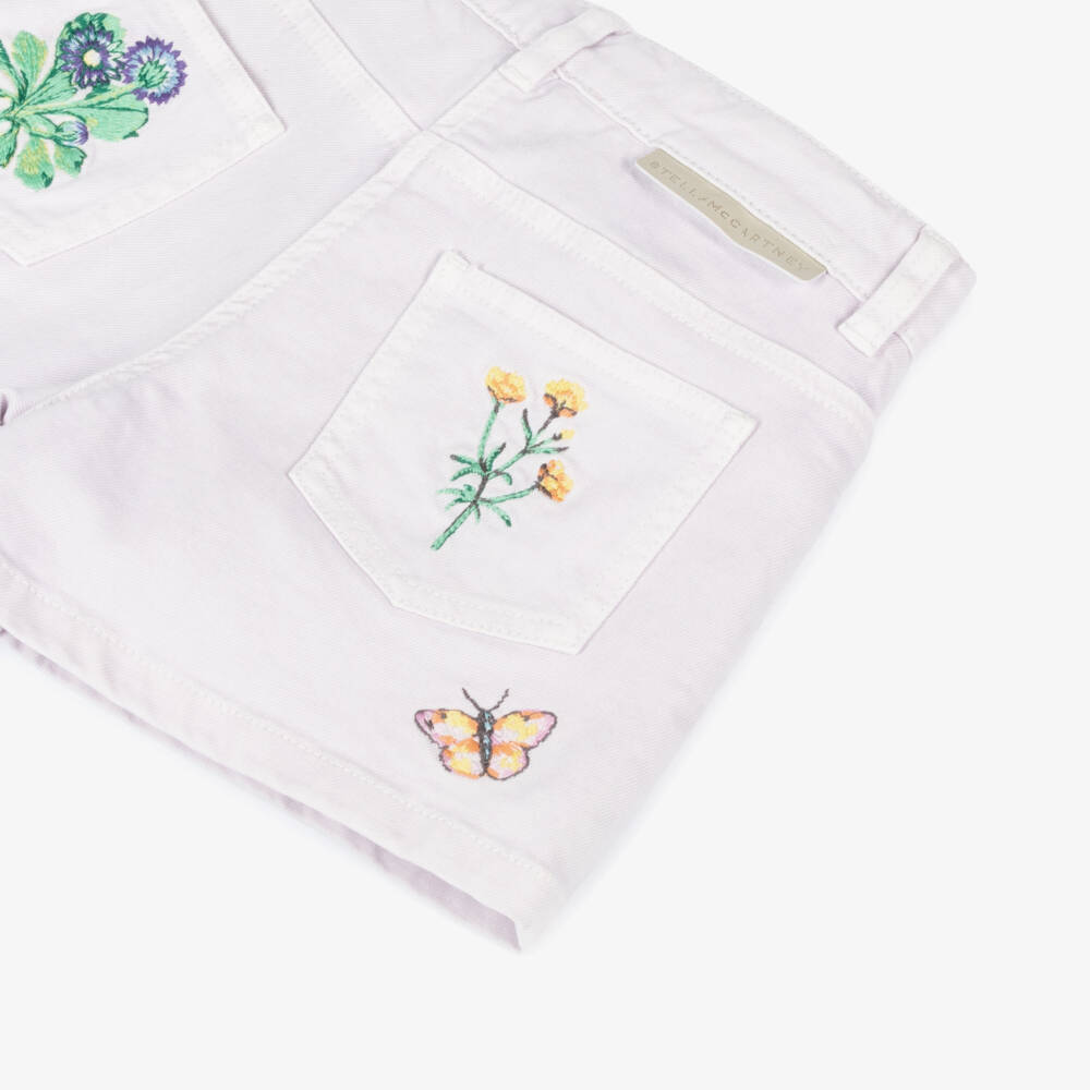 Stella McCartney Kids-Джинсовые шорты с цветочным узором для девочек в сиреневом цвете | Childrensalon Outlet