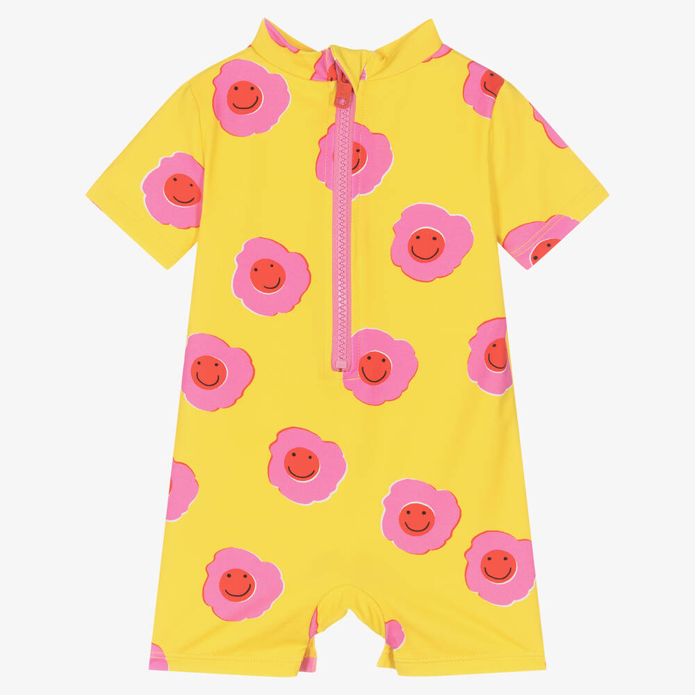 Stella McCartney Kids - Желтый солнцезащитный комбинезон с розовыми цветами | Childrensalon
