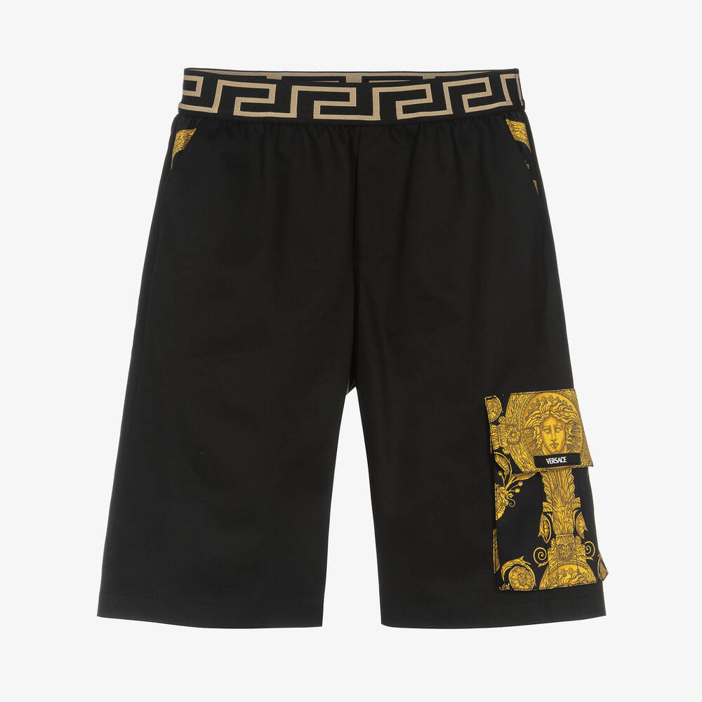Versace - Черно-золотистые шорты из хлопка с принтом Barocco | Childrensalon