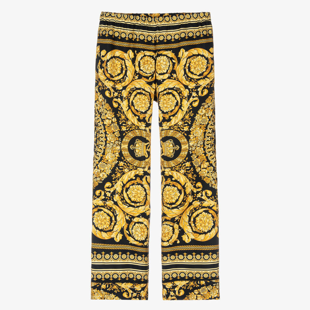Versace - Черно-золотистые шелковые брюки с принтом Barocco  | Childrensalon