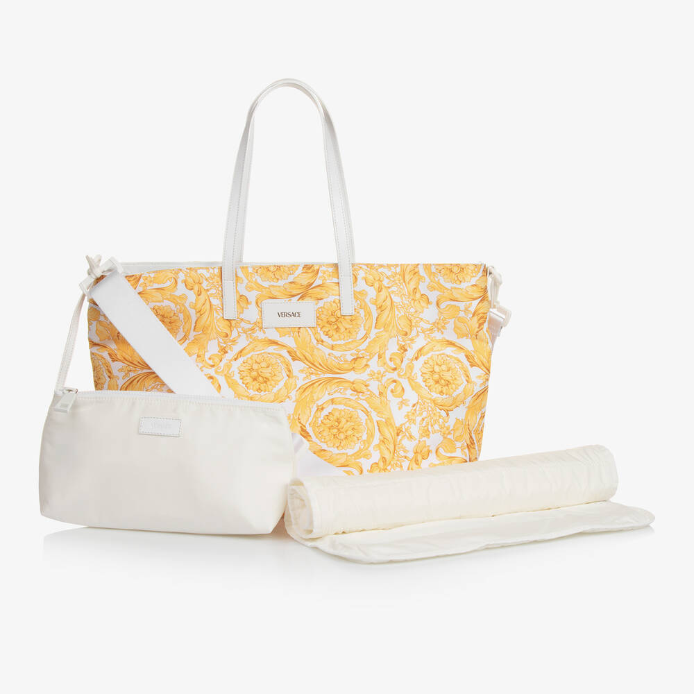 Versace - حقيبة لمستلزمات الأطفال لون أبيض وذهبي (49 سم) | Childrensalon