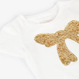 تشلدرن صالون-تيشيرت قطن جيرسي مزين بفيونكة ترتر لون عاجي وذهبي للبنات | Childrensalon Outlet